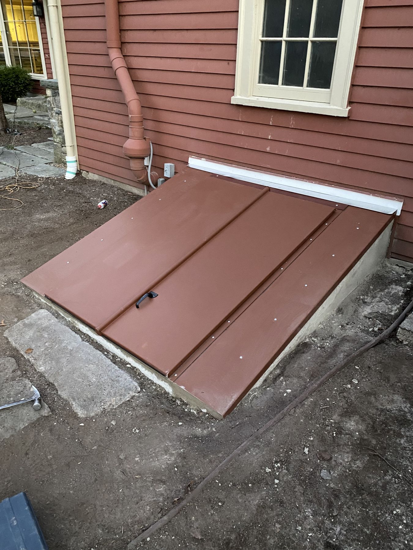 New steel bulkhead over a basement stairwell
