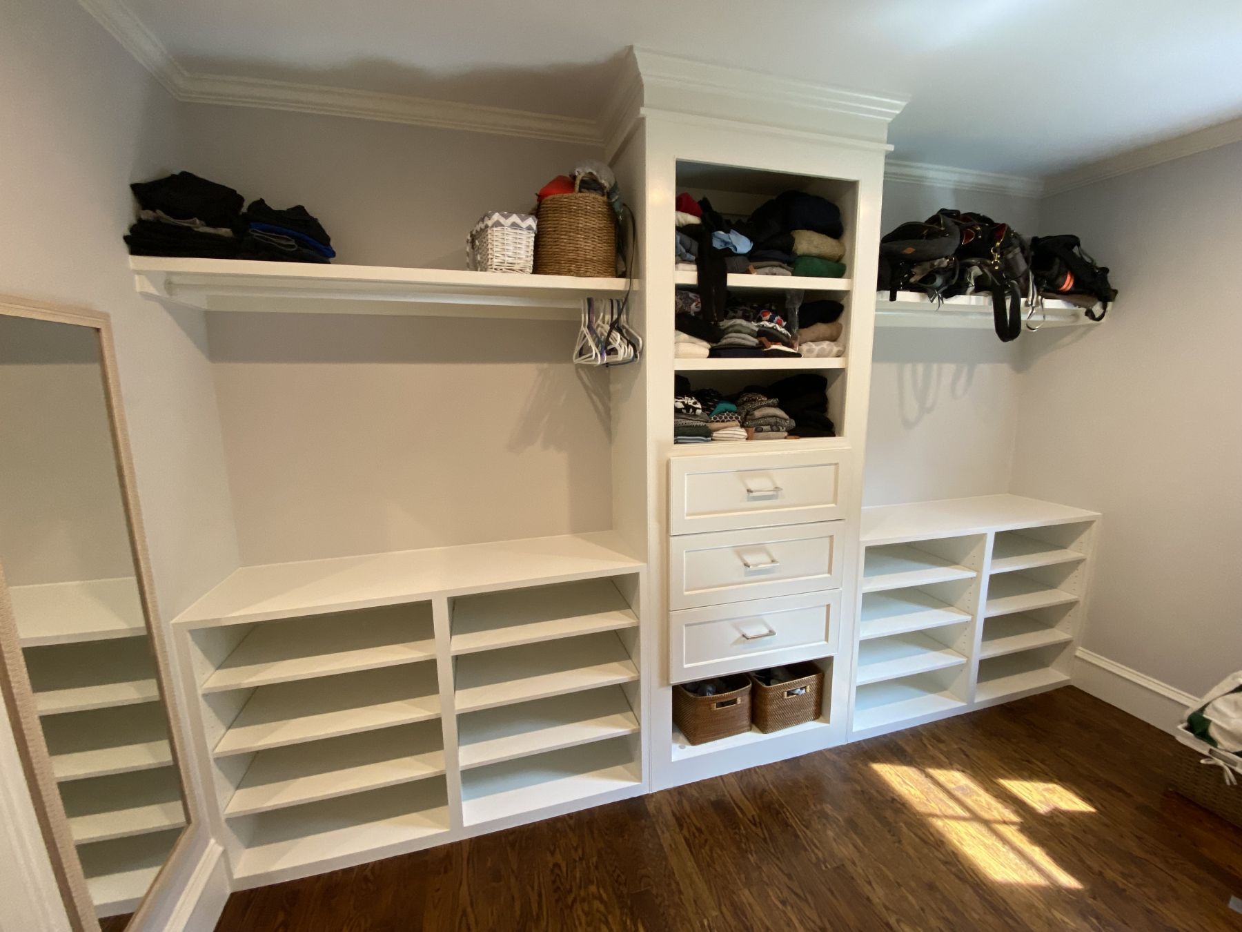 Built-in closet shelving, drawers and hanging